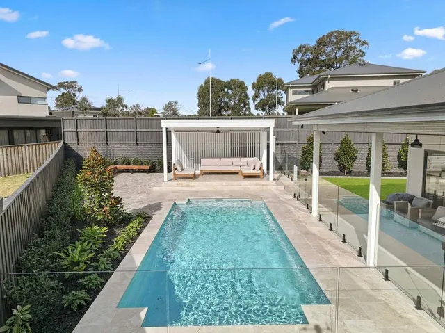Rectangular Swimming Pool in Backyard With Pergola — Newcorp Pools In Moore Creek, NSW
