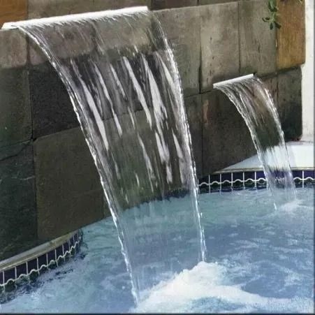 Waterfalls Cascading Into a Pool From Stone Structures — Newcorp Pools In Moore Creek, NSW