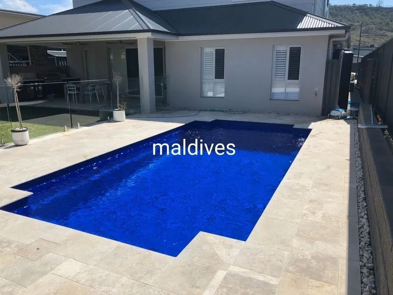 A Backyard Pool With Blue Tiles — Newcorp Pools In Moore Creek, NSW