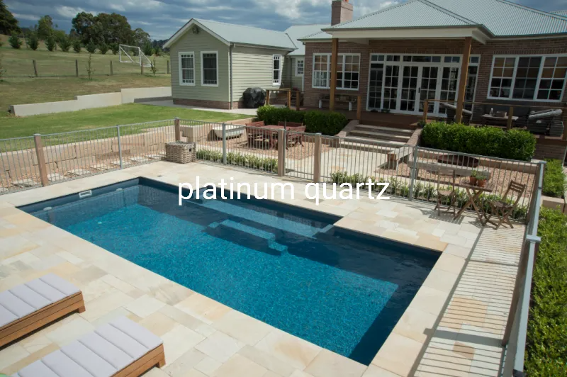 Swimming Pool With a Stone Patio, Steps, and a Luxury House — Newcorp Pools In Moore Creek, NSW