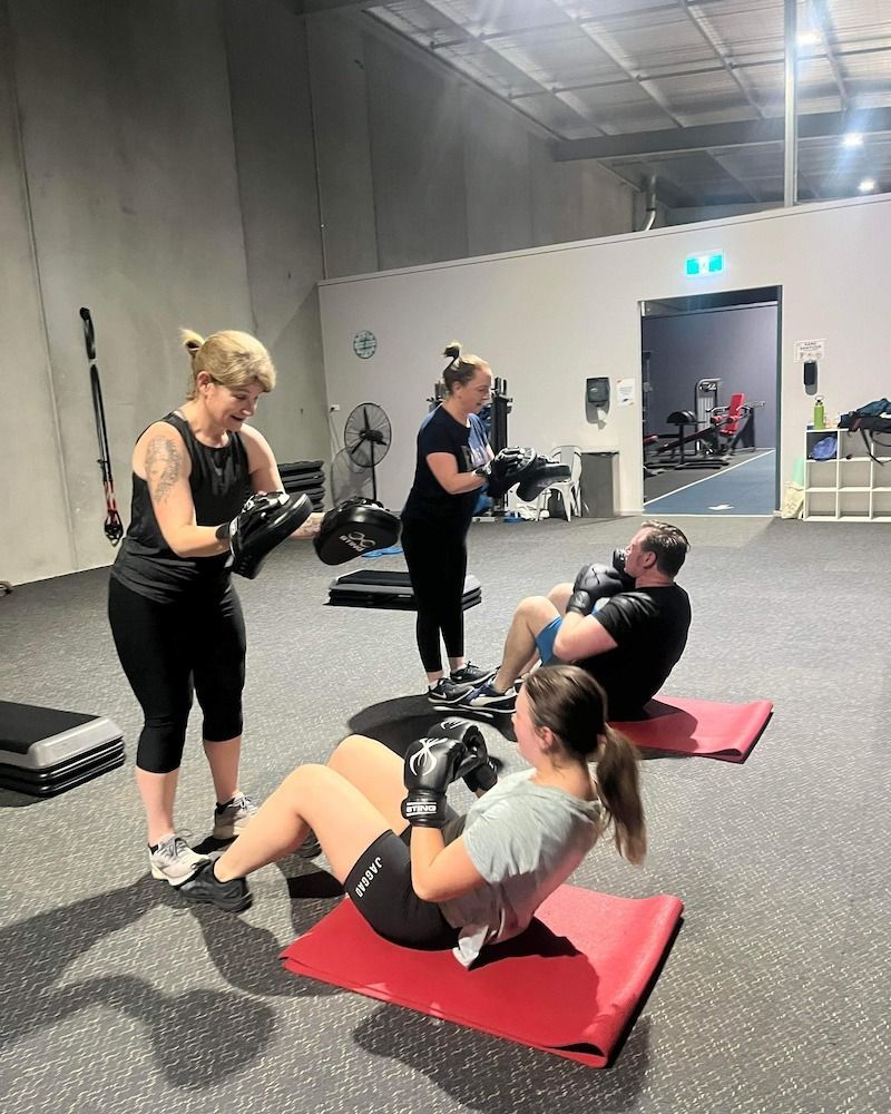 Two Sporty Dirls Doing Exercises With Fitness Balls In The Gym — Fitness Studio & Gym in Sebastopol