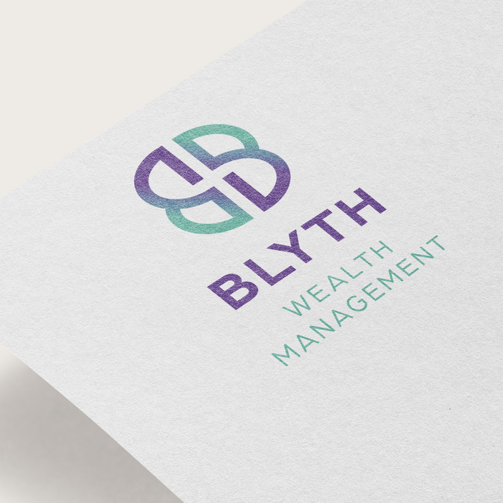 A close up of a logo for blythe wealth management
