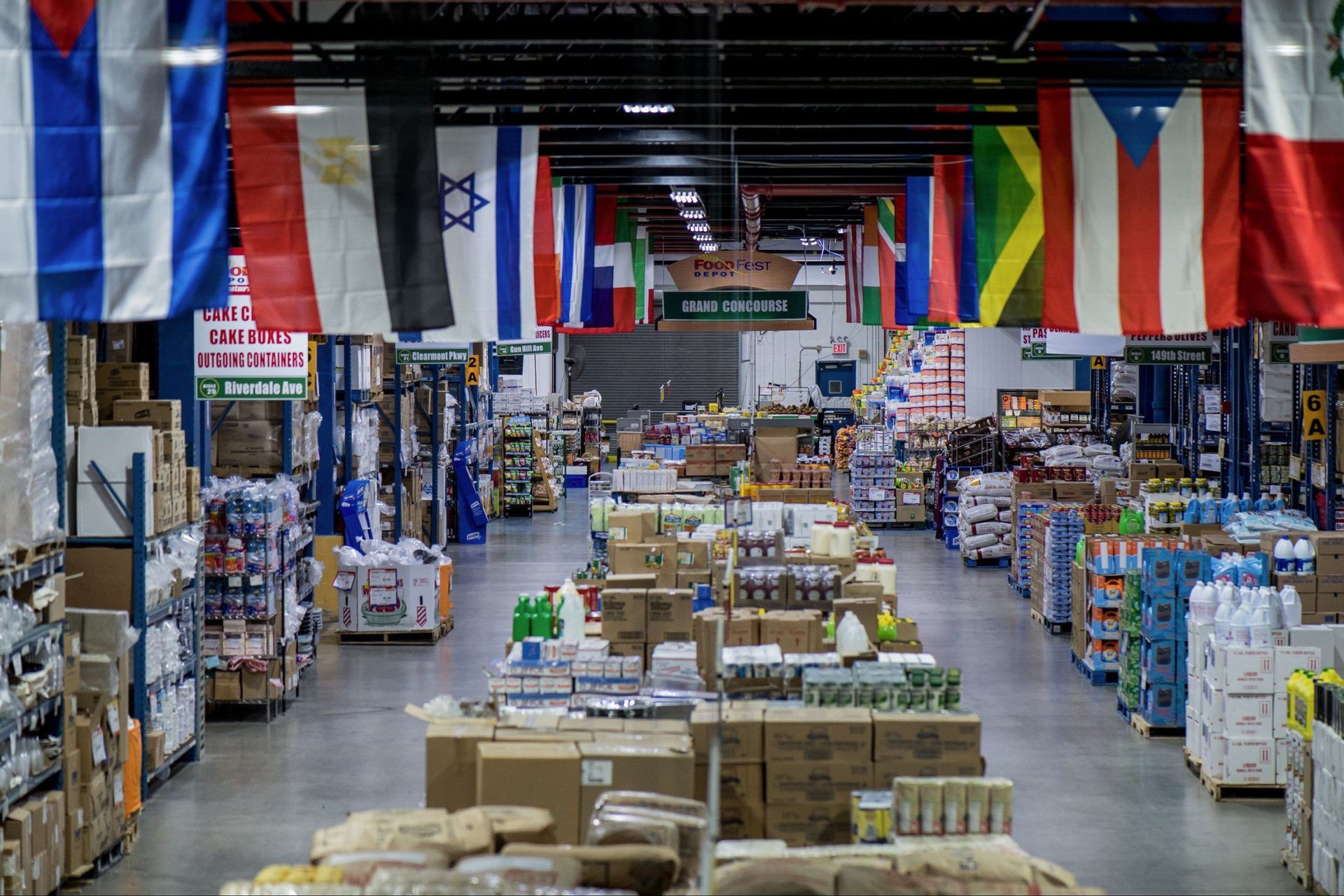 A store filled with lots of boxes and flags hanging from the ceiling.