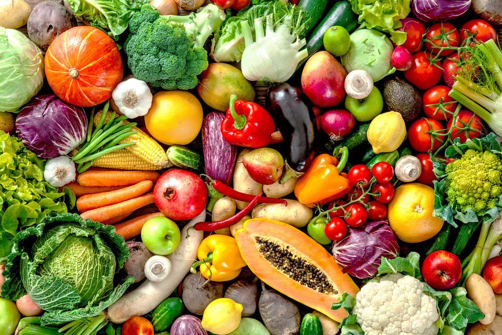 There are many different types of fruits and vegetables in this picture.
