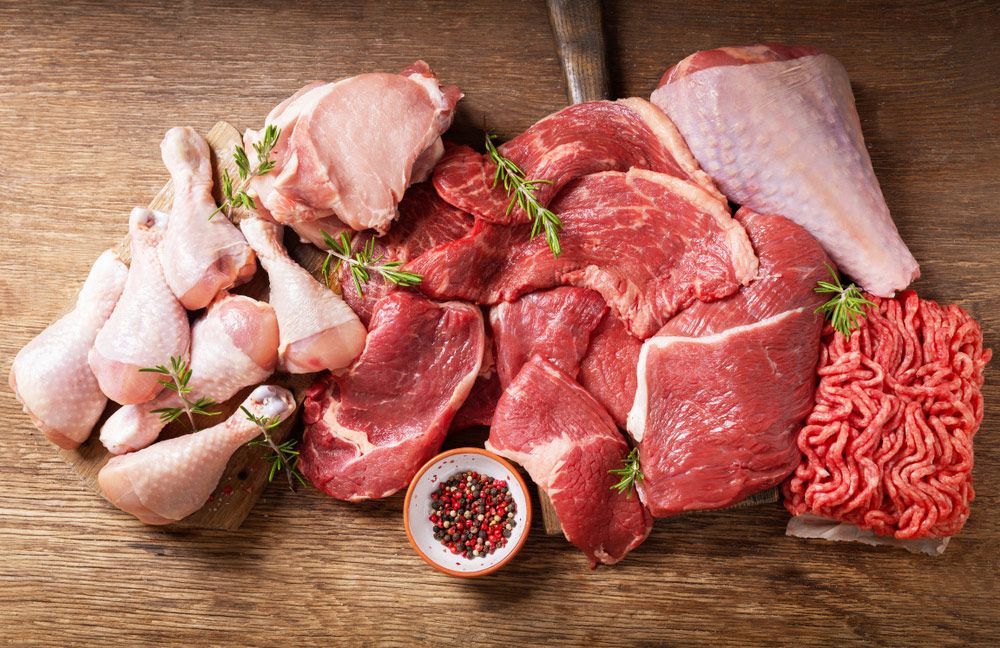 There are many different types of meat on the table.
