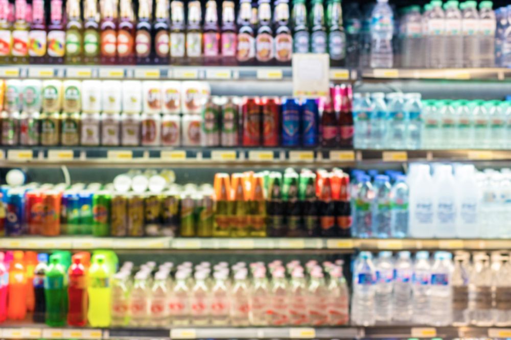There are many different types of beverages on the shelves in this store.
