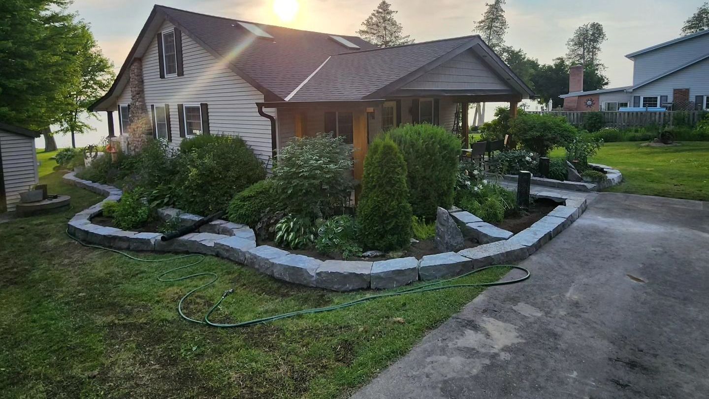 A house with a lot of plants in front of it