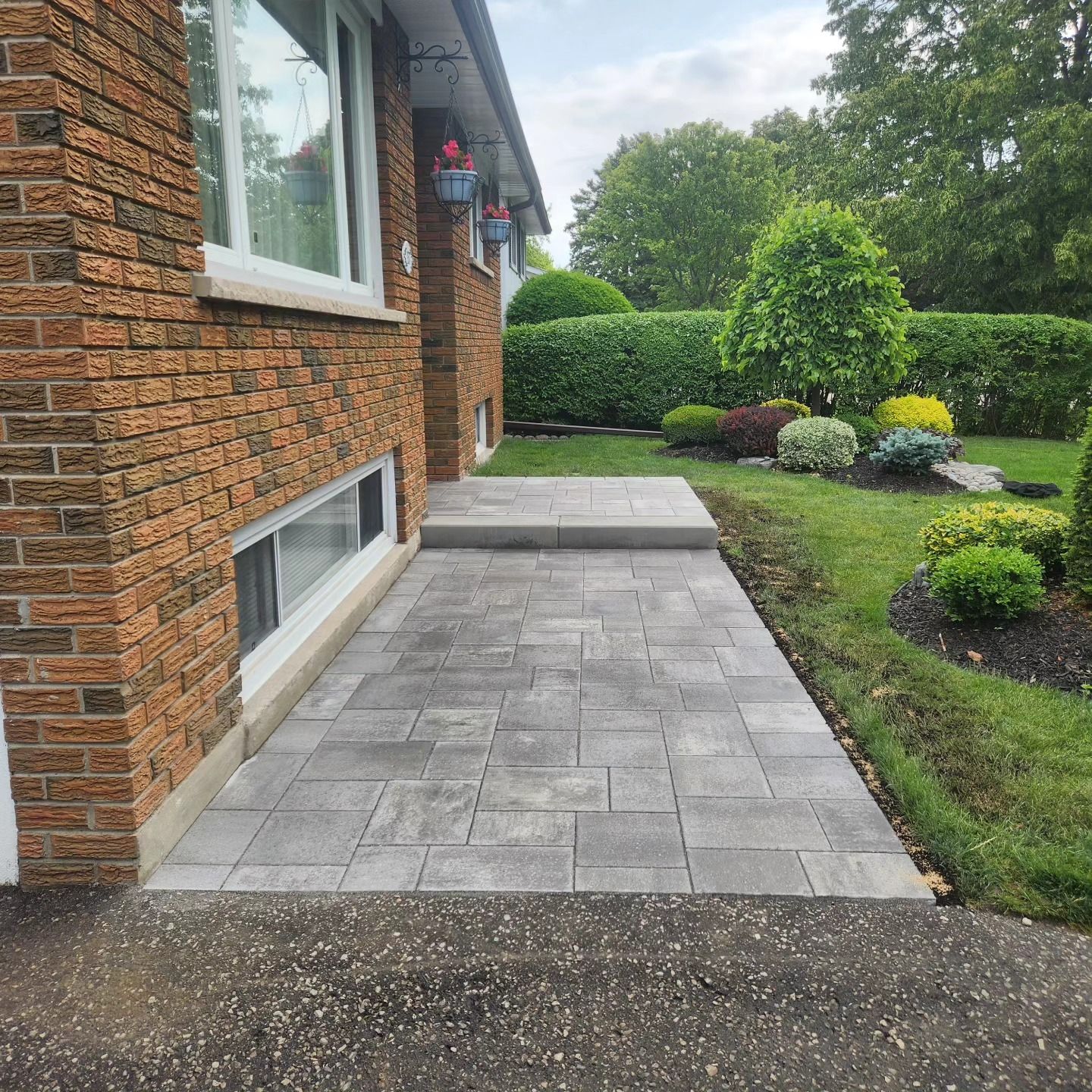 A brick house with a walkway in front of it
