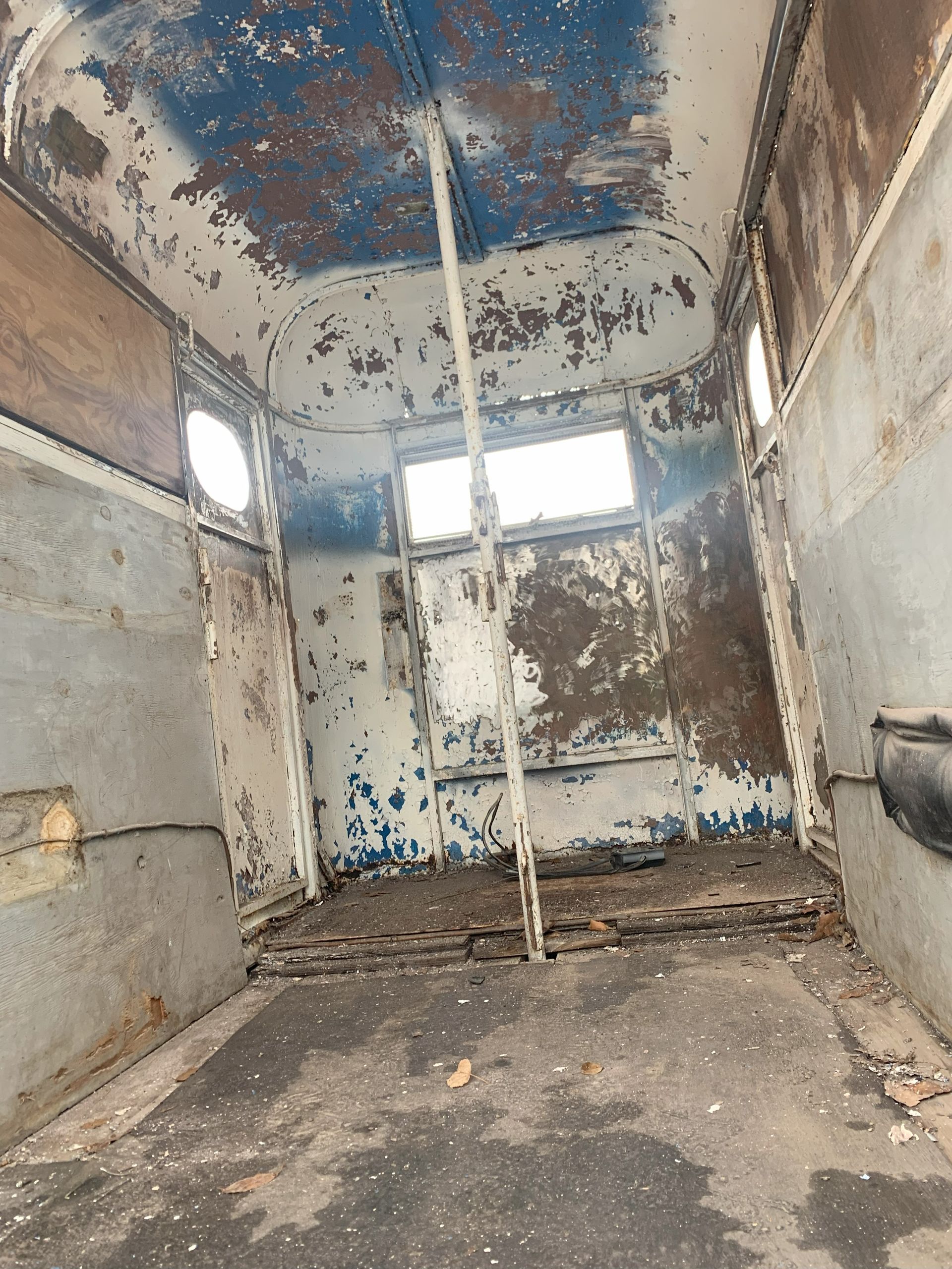 Removing paint and rust from a trailer