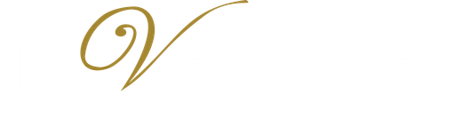 Travel Time Logo in White with a Gold cursive V