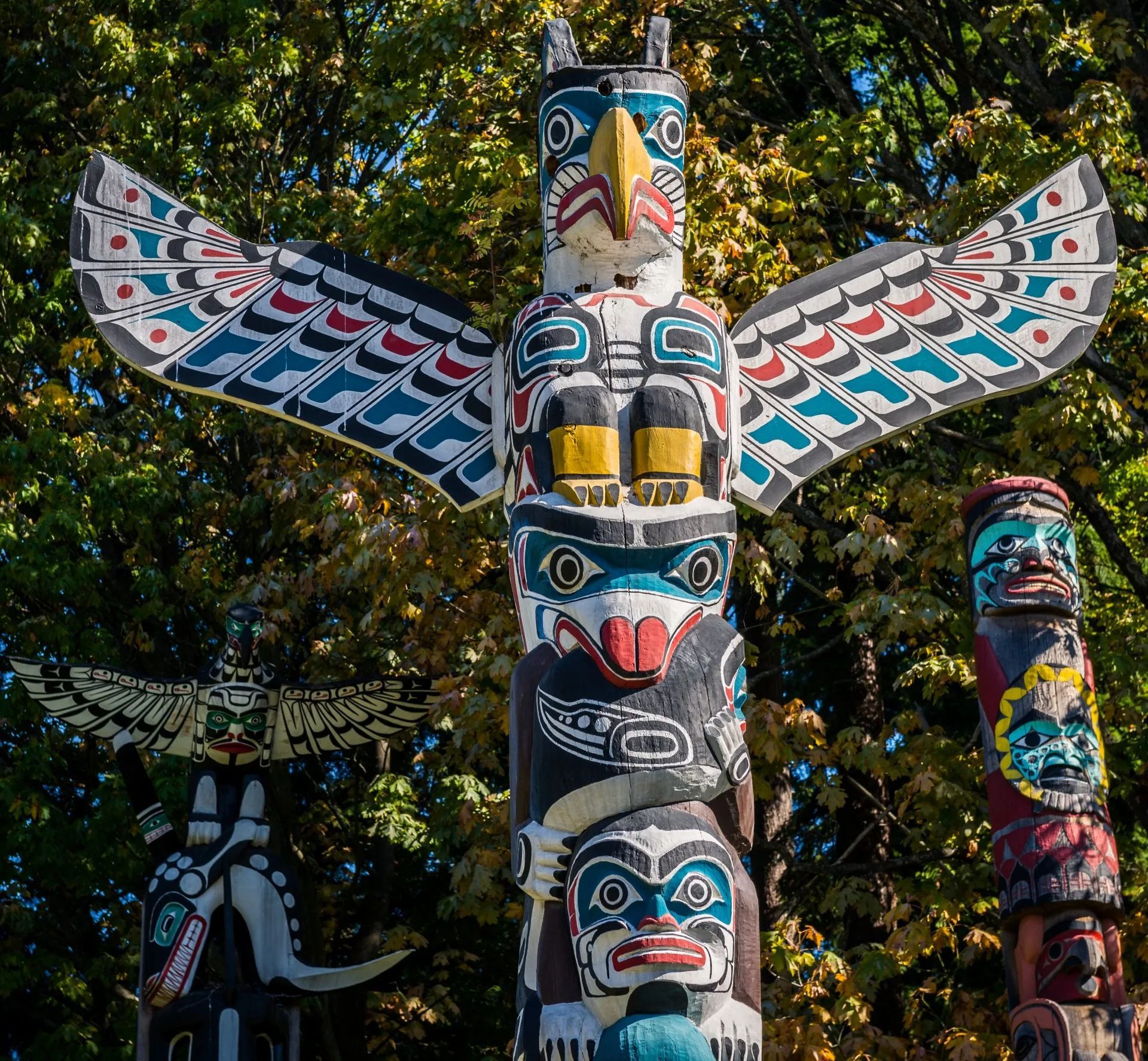 A trio of Native American totem poles