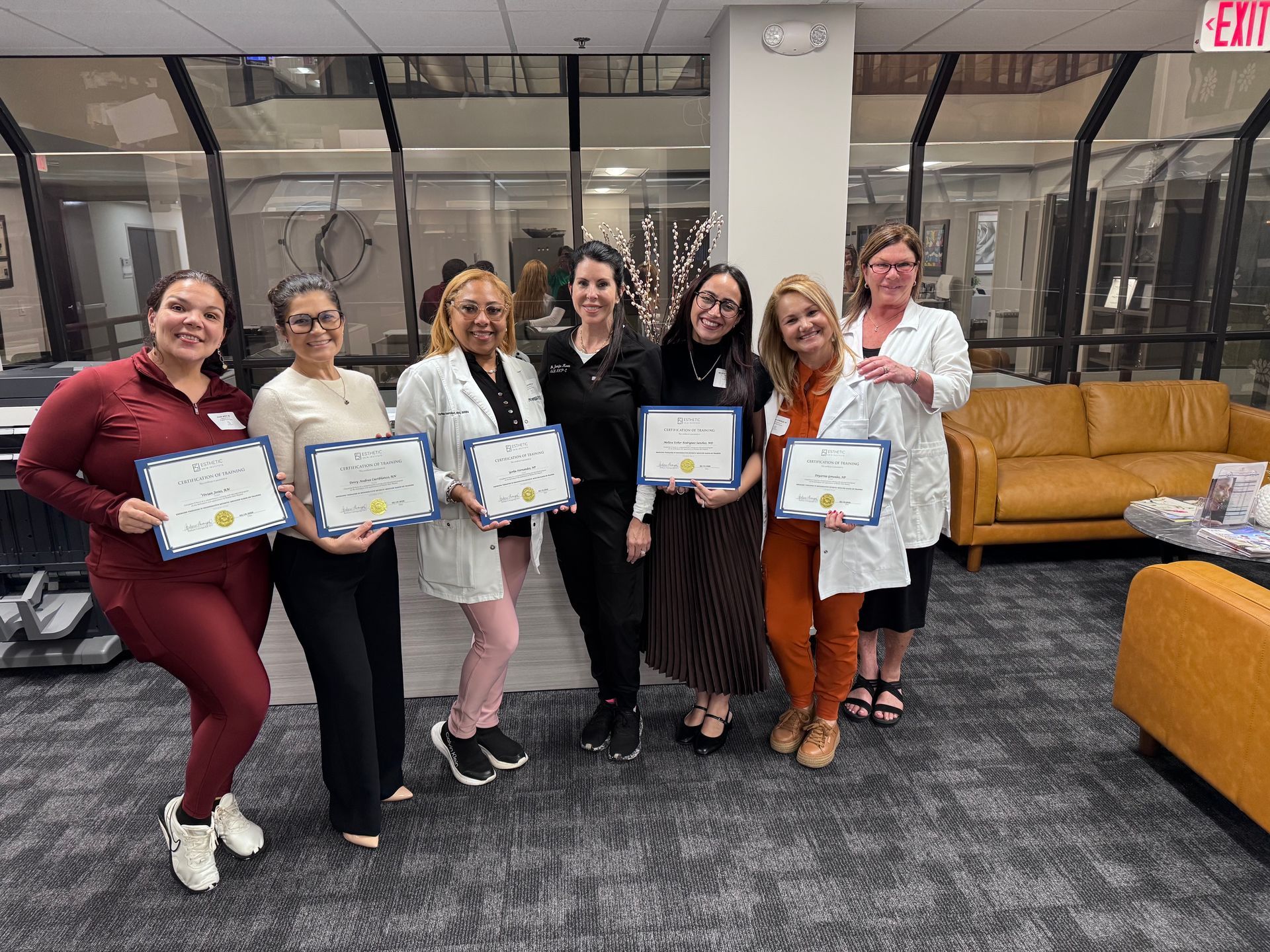 A group of medical esthetic students who completed a course.