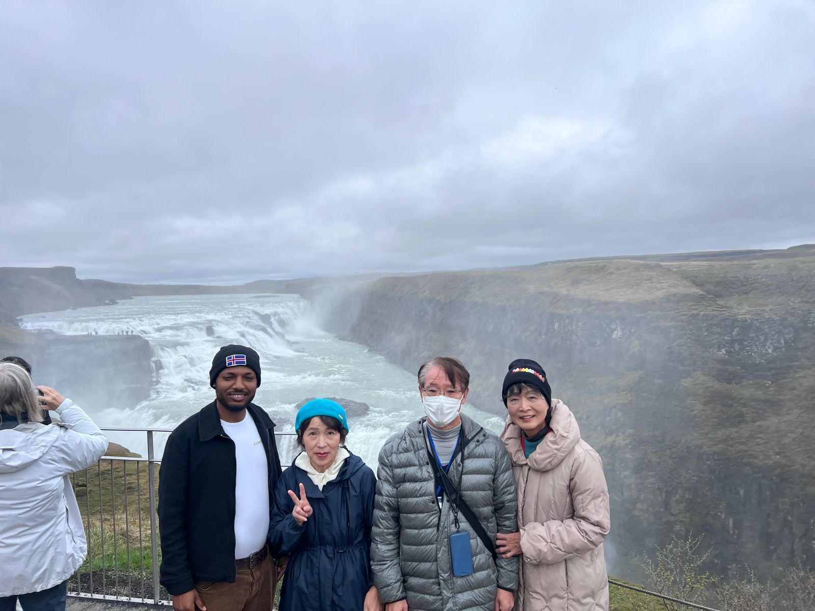 Happy cruise guests from Japan on a private tour of the Golden Circle in Iceland with Teka.
