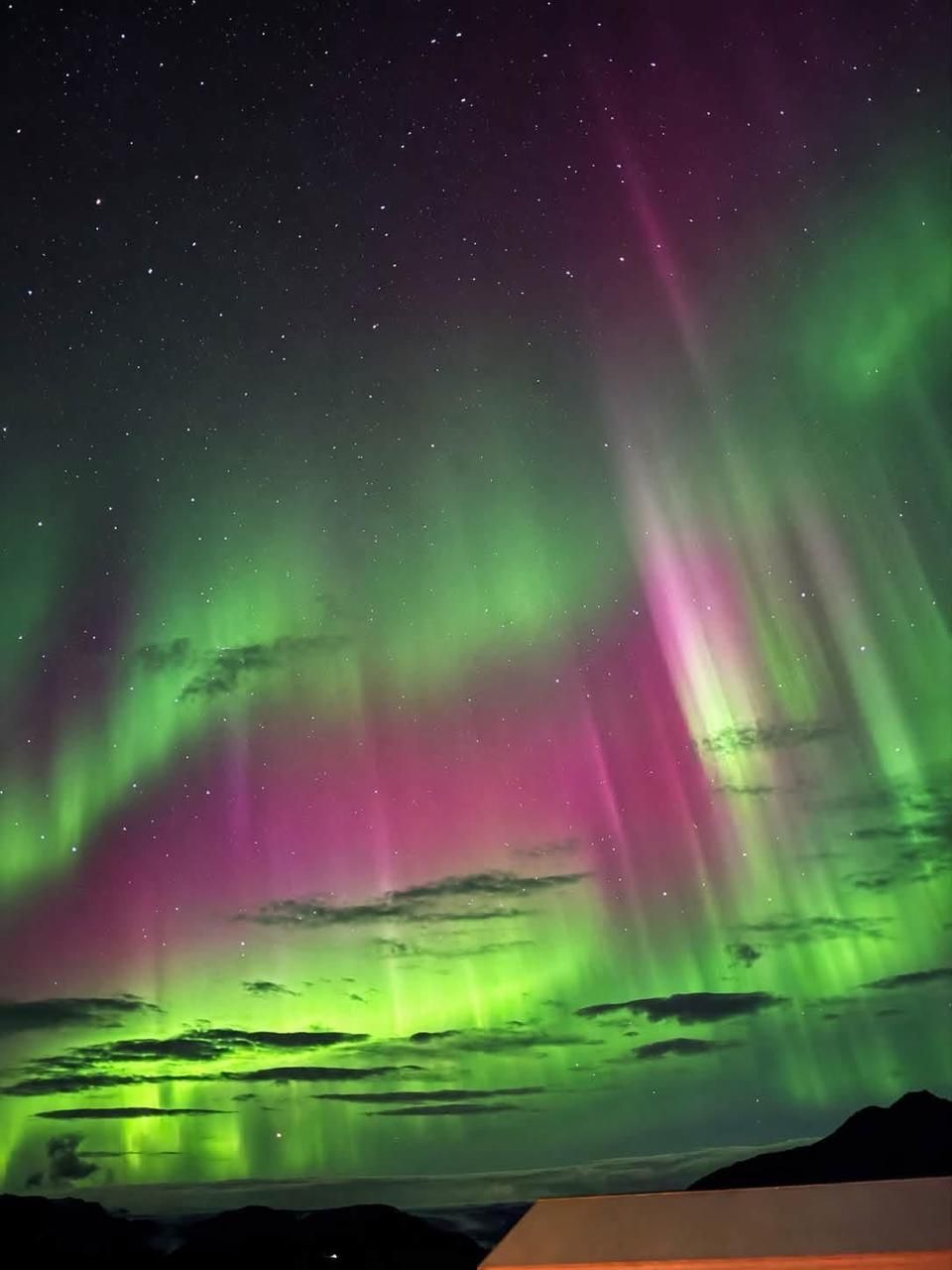 Northern Lights dancing across the night sky in Iceland