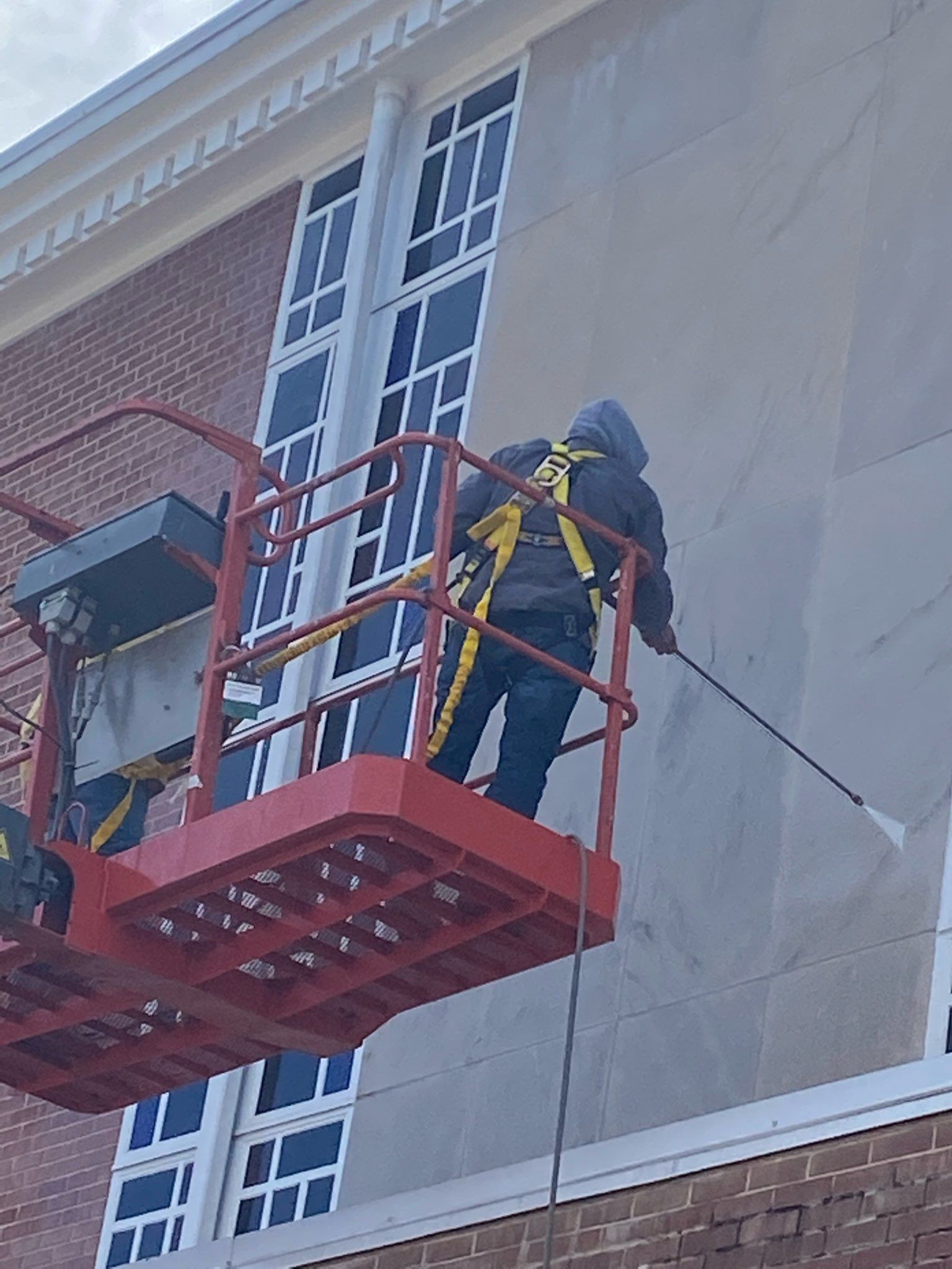 Worker Using Pressure Washer