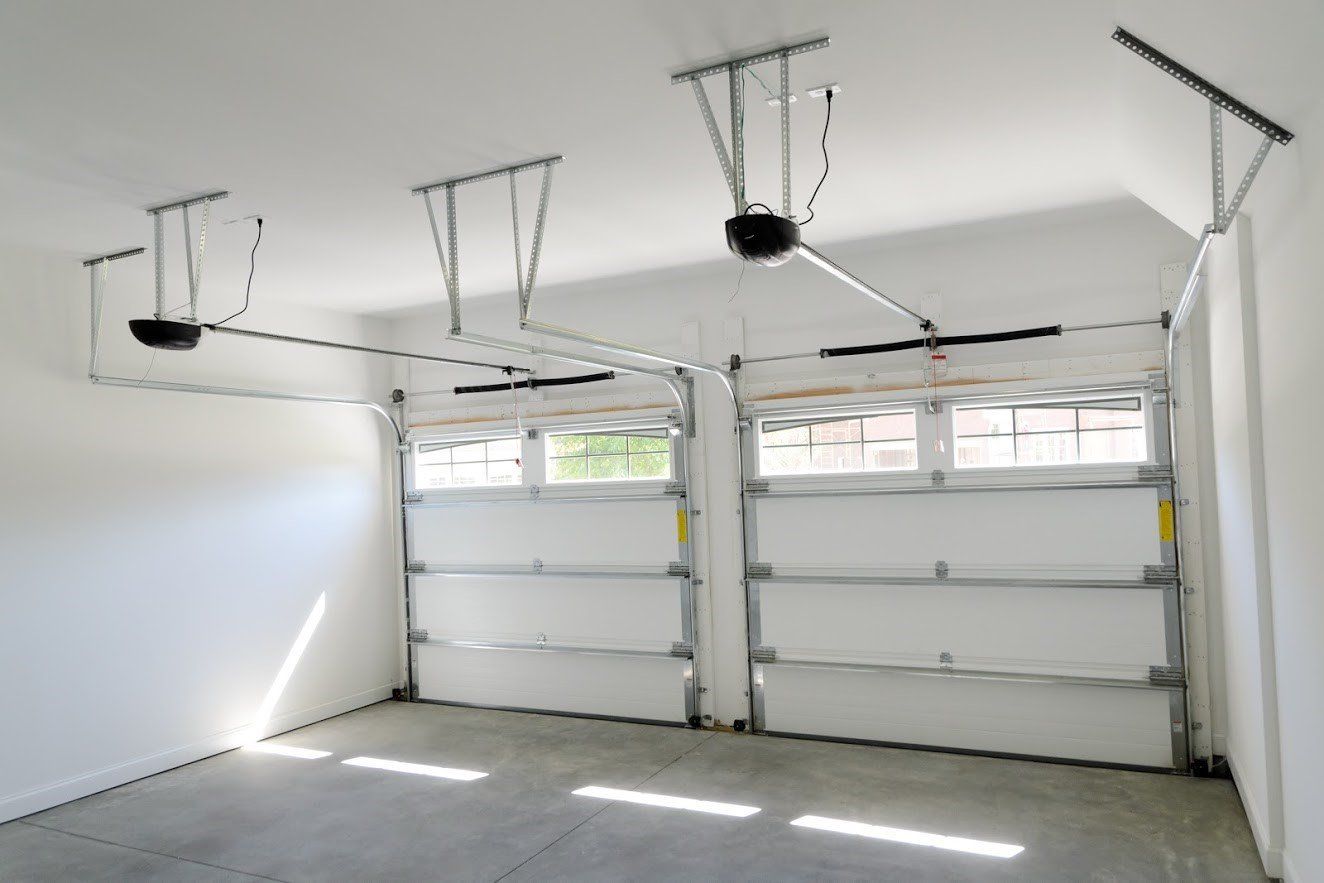 Empty White Garage — Signal Hill, CA — Edgemont Garage Door Service Empty White Garage — Signal Hill, CA — Edgemont Garage Door Service