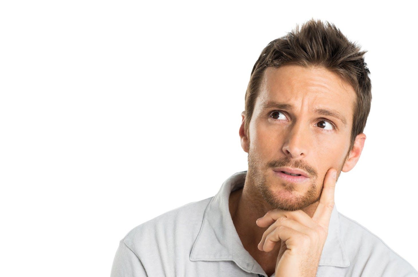 Man with light brown hair, looking up and to the side, hand on chin, thoughtful expression.