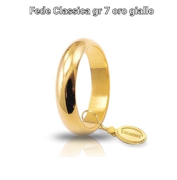 Fede nuziale in oro giallo con targhetta.