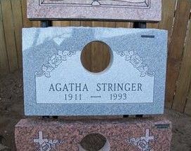 Gray gravestone plaque reading “Agatha Stringer 1911–1993” with circular photo opening