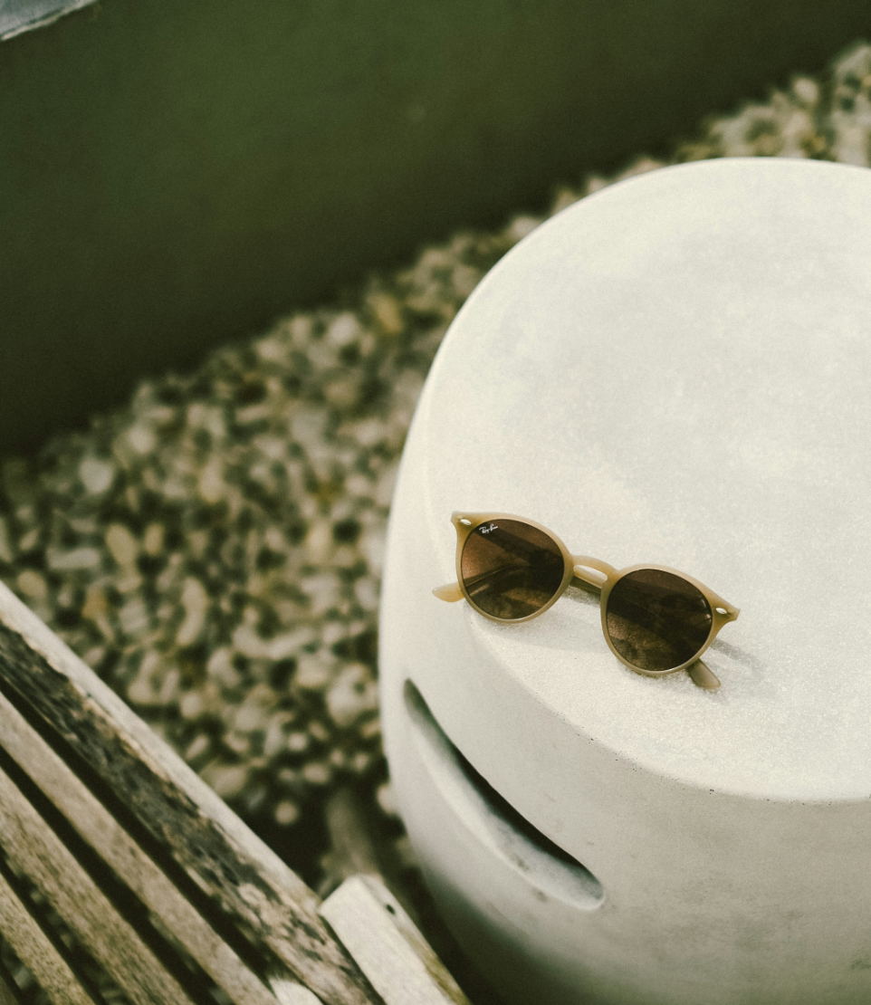 sunglasses on white table