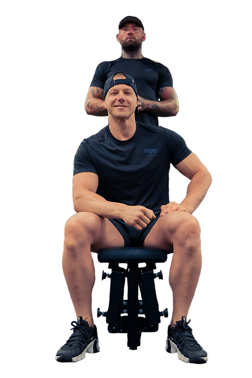 Two men are standing next to each other on a bench.