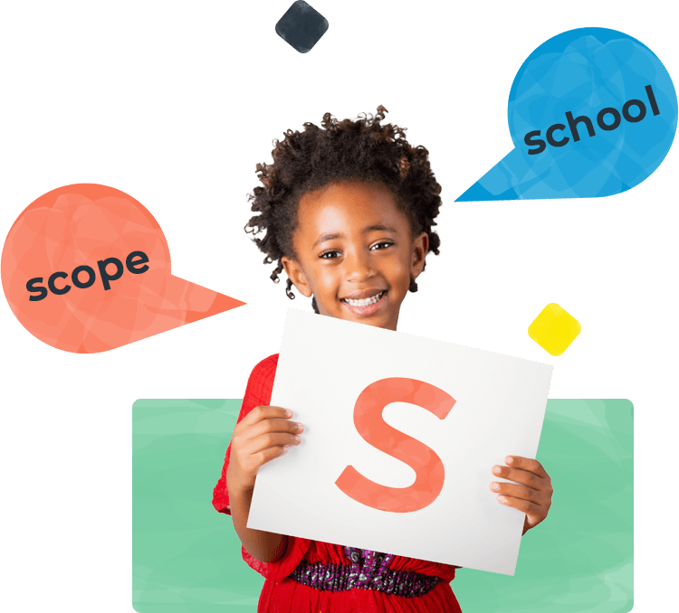 Little girl holding a paper with a letter S
