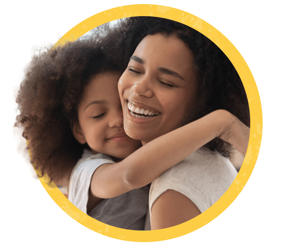 daughter hugs smiling mom