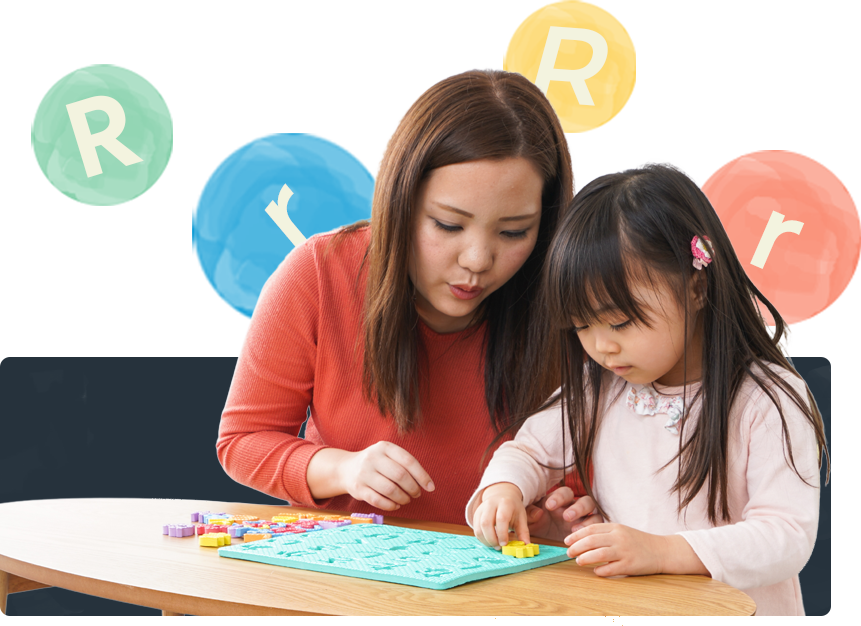 A mom and her toddler daughter doing an activity together