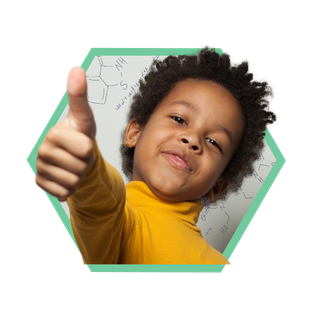 A smiling boy holding his thumb up in approval