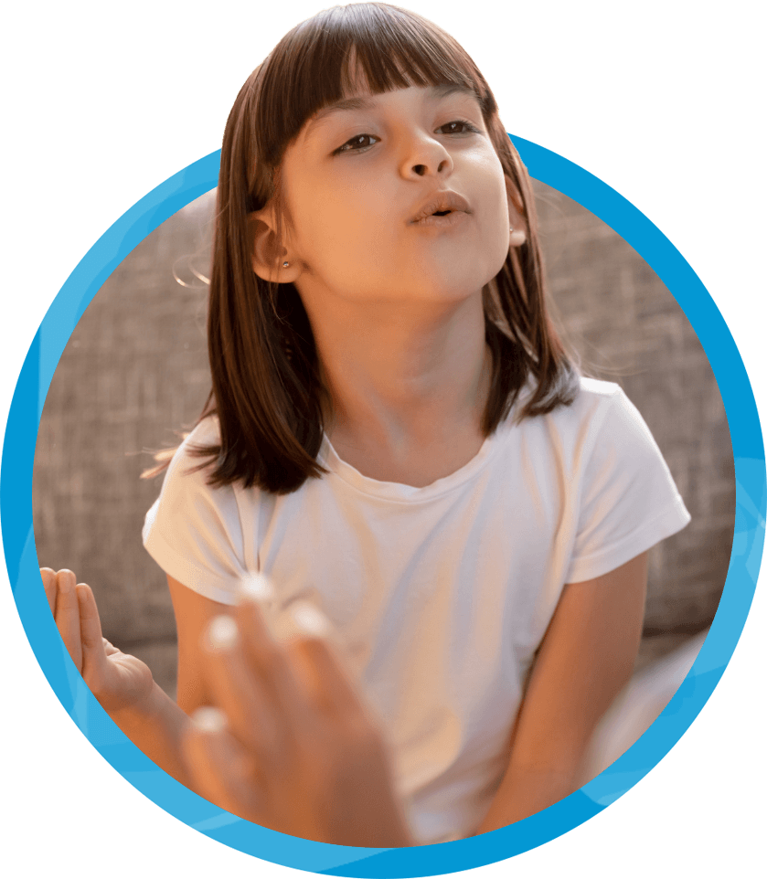 young girl in white shirt practicing how to pronounce O sounds