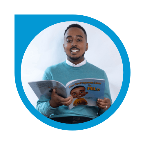 Myles Nobles holding the Courageous Lion in Milo book