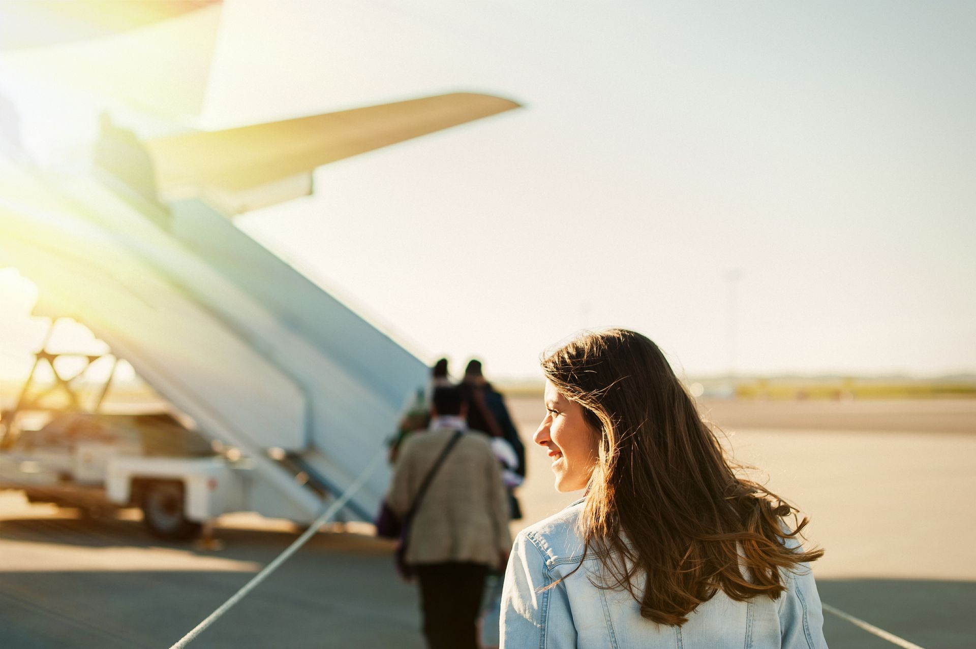 woman boarding a plane - immune iv therapy at sante wellness