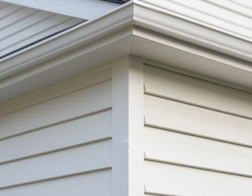 Repaired vinyl siding and fascia trim