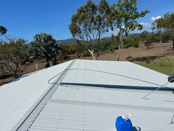 Different Houses with Similar Grey Metal Roofing — Roofer in Douglas, QLD