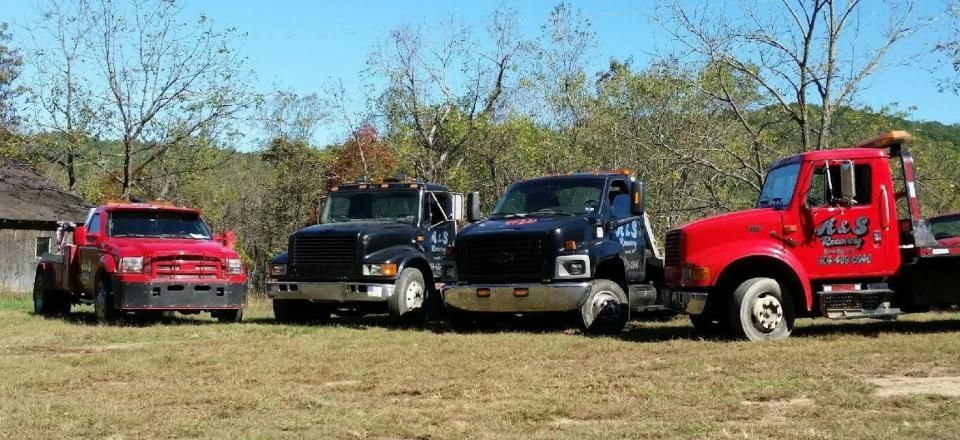 four A & S Recovery towing trucks