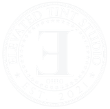 A white logo with the letter e in the center of a circle.