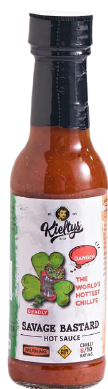 A bottle of Kickapoo's Savage Bastard hot sauce with a leprechaun graphic on a white label against a green and orange trim.
