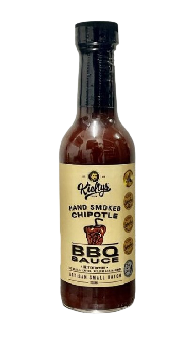 A bottle of Kuku’s Hand Smoked Chipotle BBQ Sauce with a beige label on a white background.