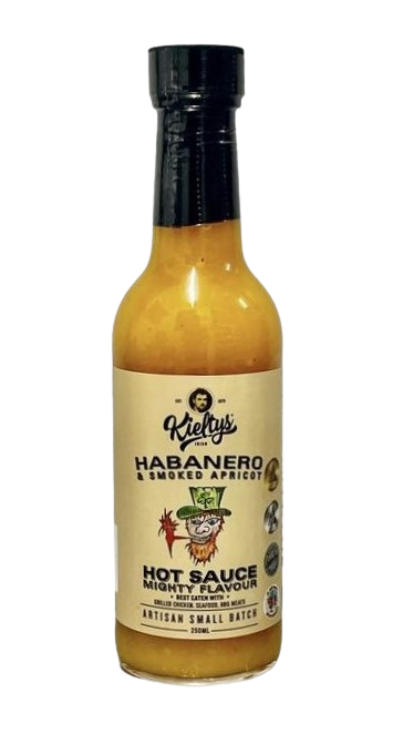 A bottle of Kielty’s Habanero & Smoked Apricot hot sauce with a leprechaun graphic on a beige label.
