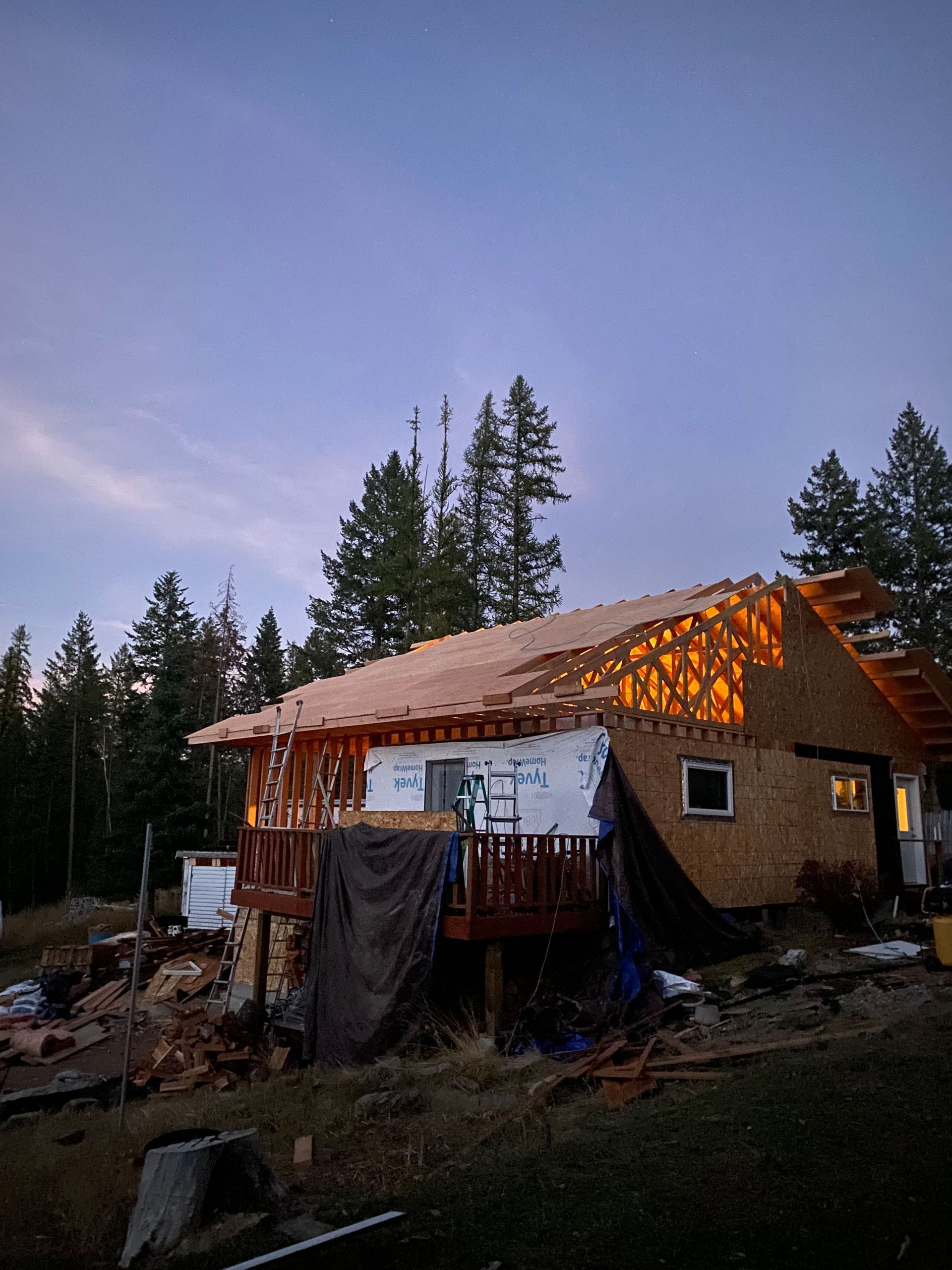 A house is being built in the middle of a forest.