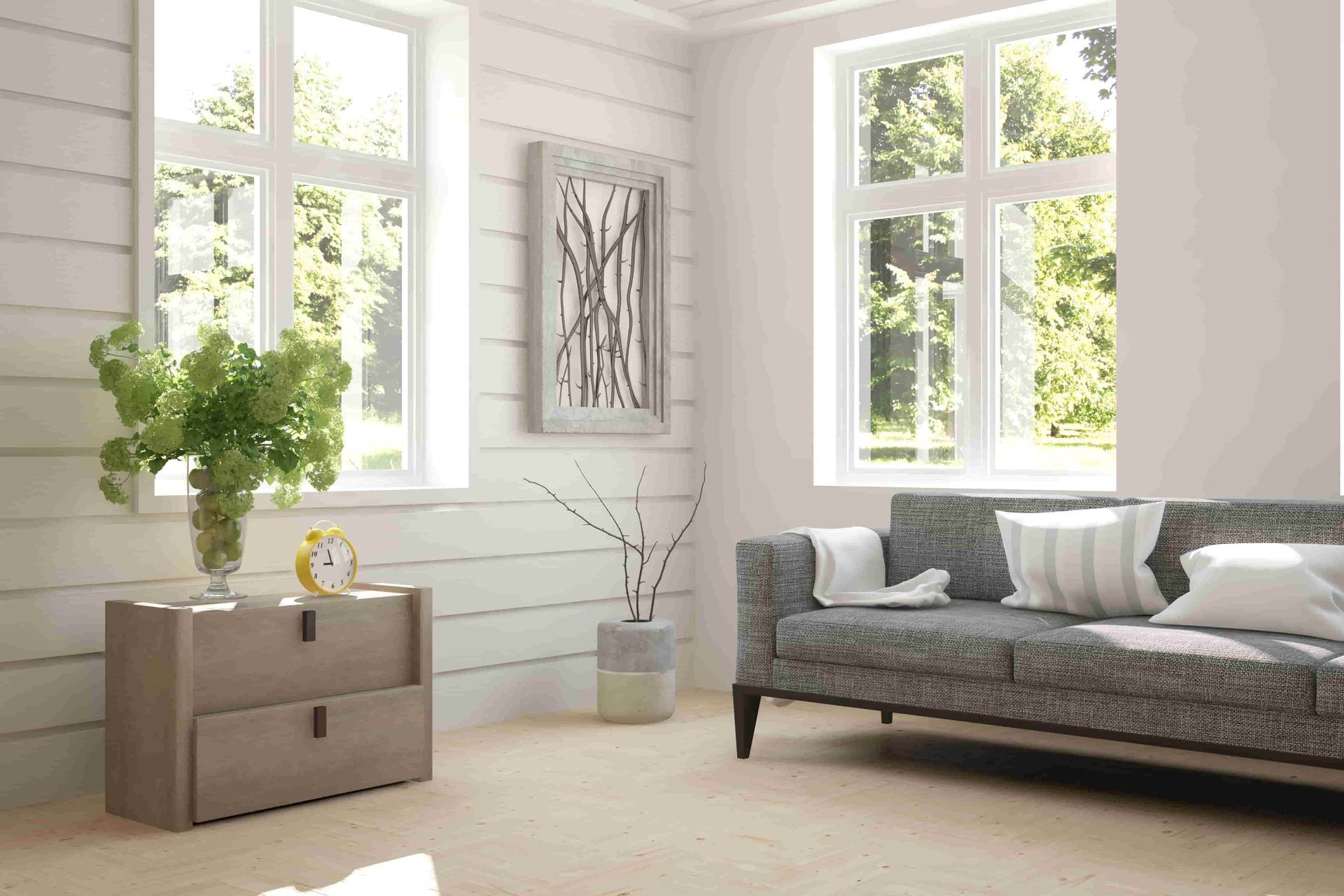 A living room with a couch, dresser, and, two windows.