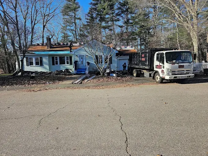 A truck is parked in front of a house.
