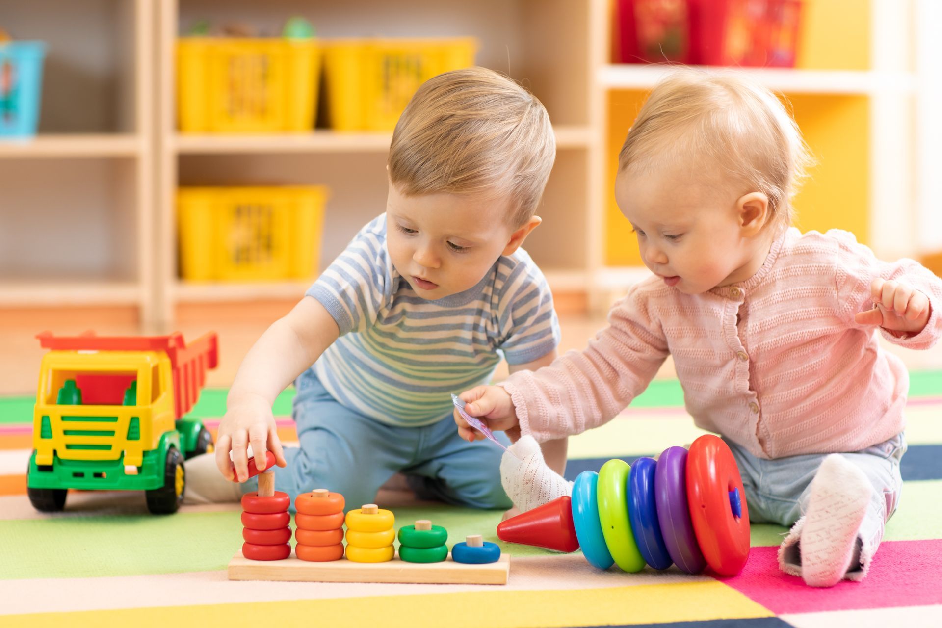 little boy playing at a table
