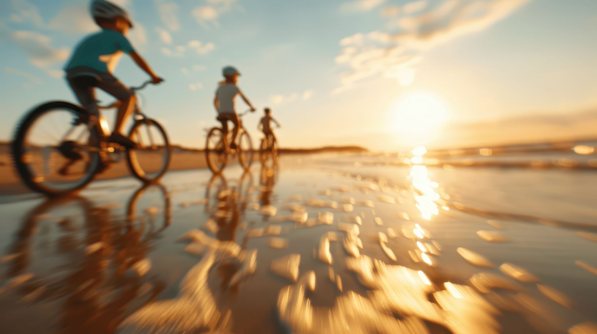 kids on bikes at the beach
