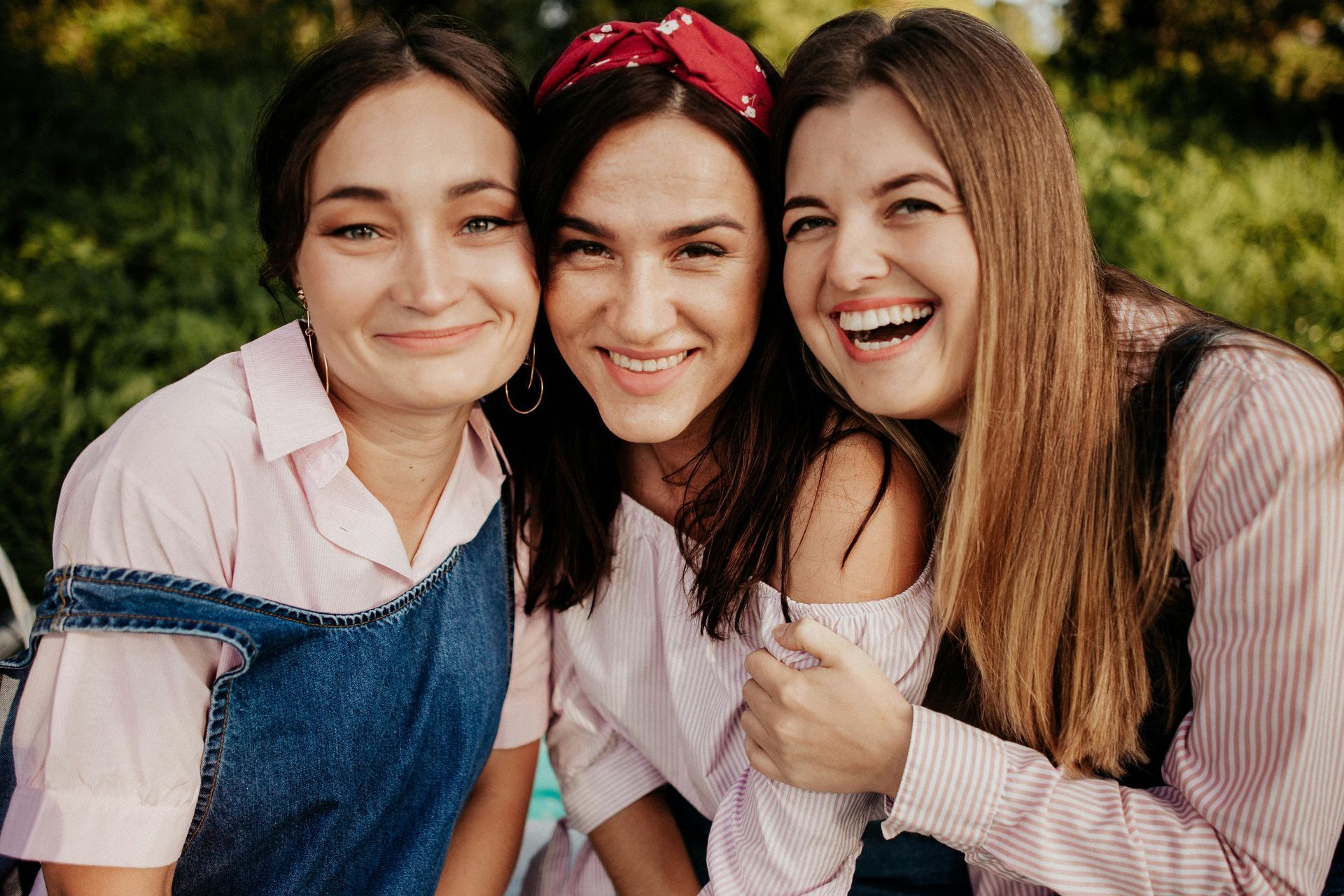 friends smiling at a camera