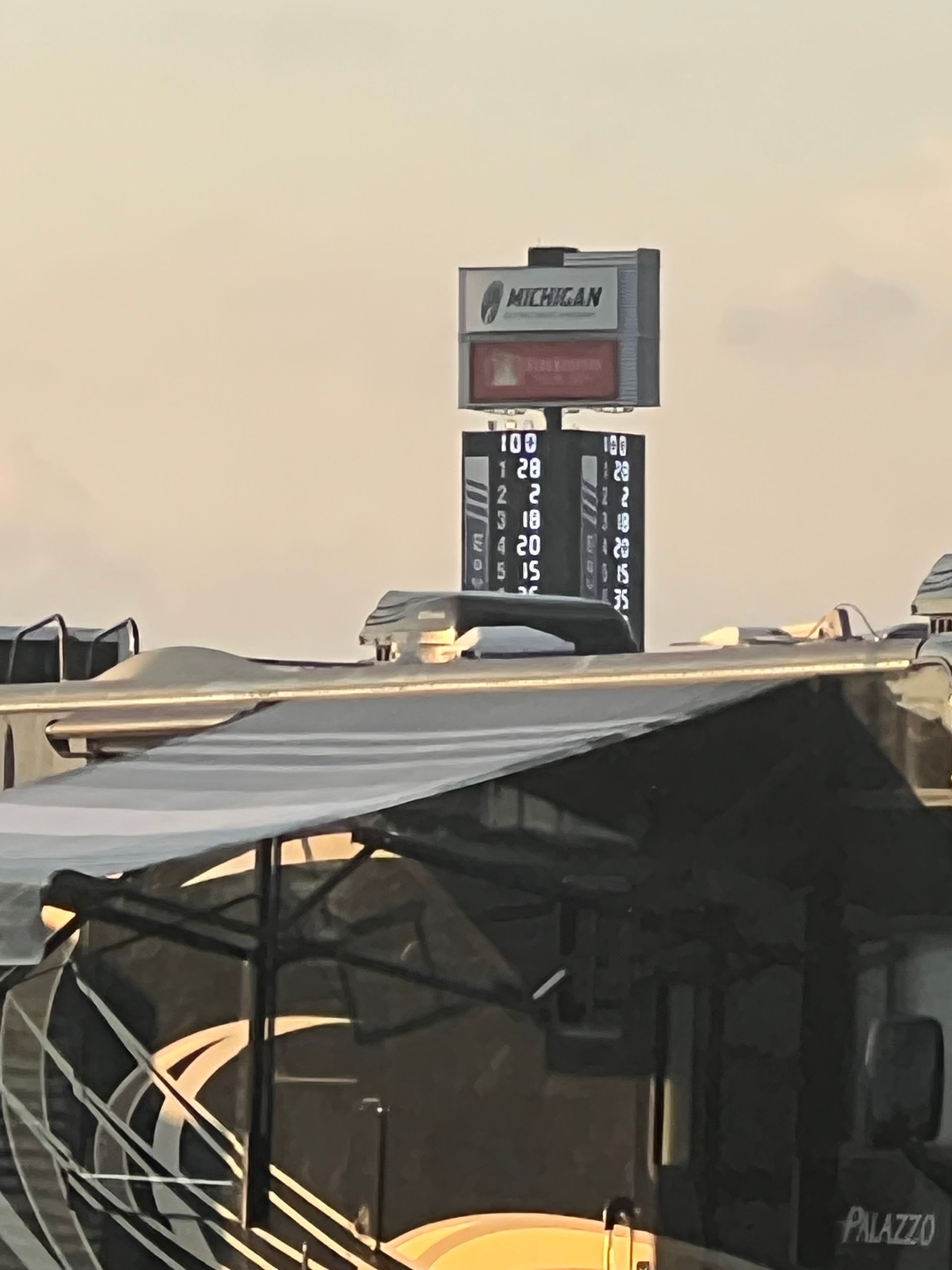 Sign for Morgan with a scoreboard, viewed above RV.