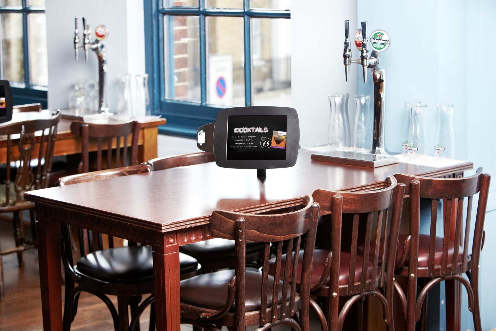 iPad menu & beer tap on table in pub