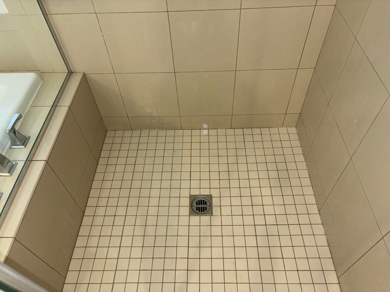 A bathroom counter with a sink and a mirror.