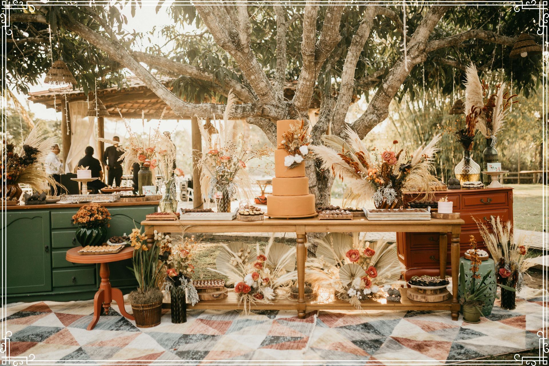 A table elegantly decorated for an outdoor fall wedding