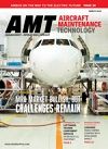Aviation magazine cover showing a jet nose in a hangar, with headlines overlaid.